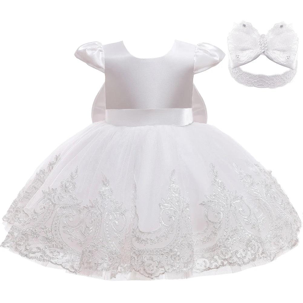 baby white special occasion dress with satin bodice, lace embroidered skirt, and matching headband