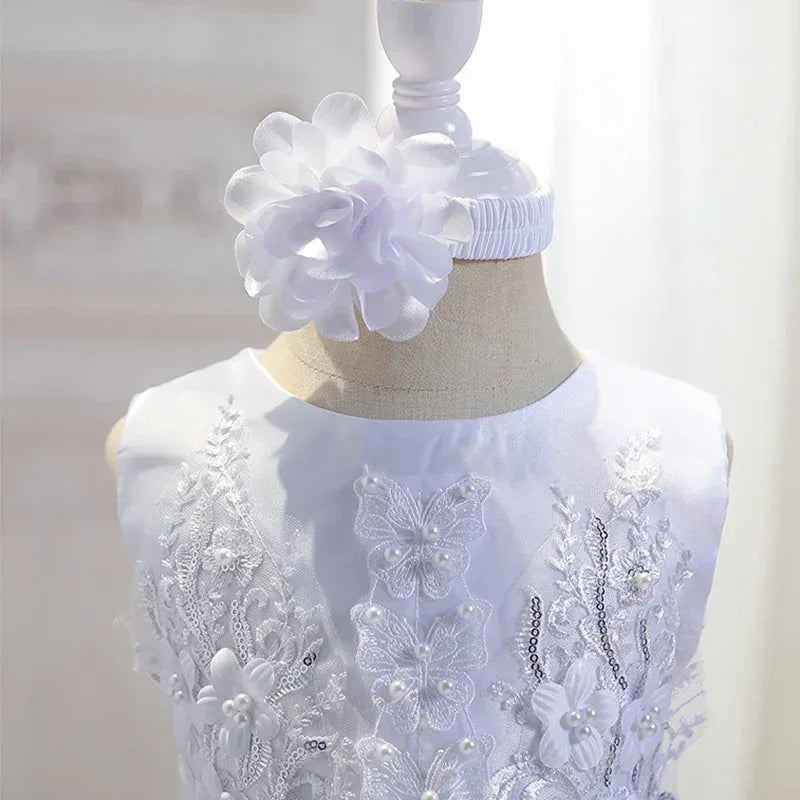 White special occasion dress for babies with floral lace and pearl embellishments, sleeveless