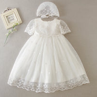 White special occasion dress for babies with lace sleeves and matching lace bonnet