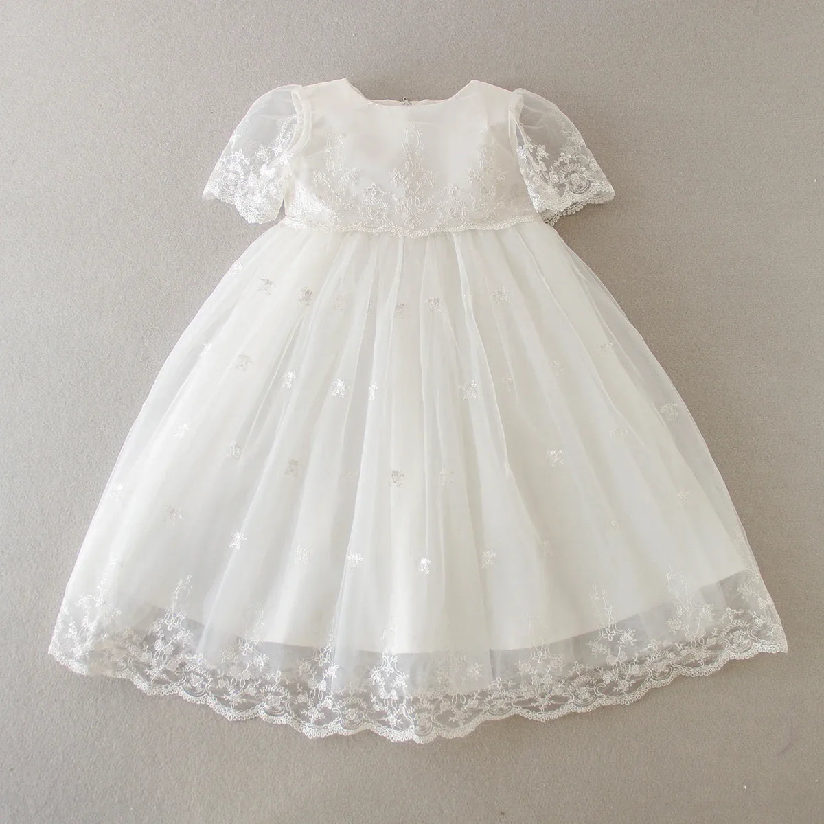 White special occasion dress for babies with lace short sleeves and embroidered tulle skirt