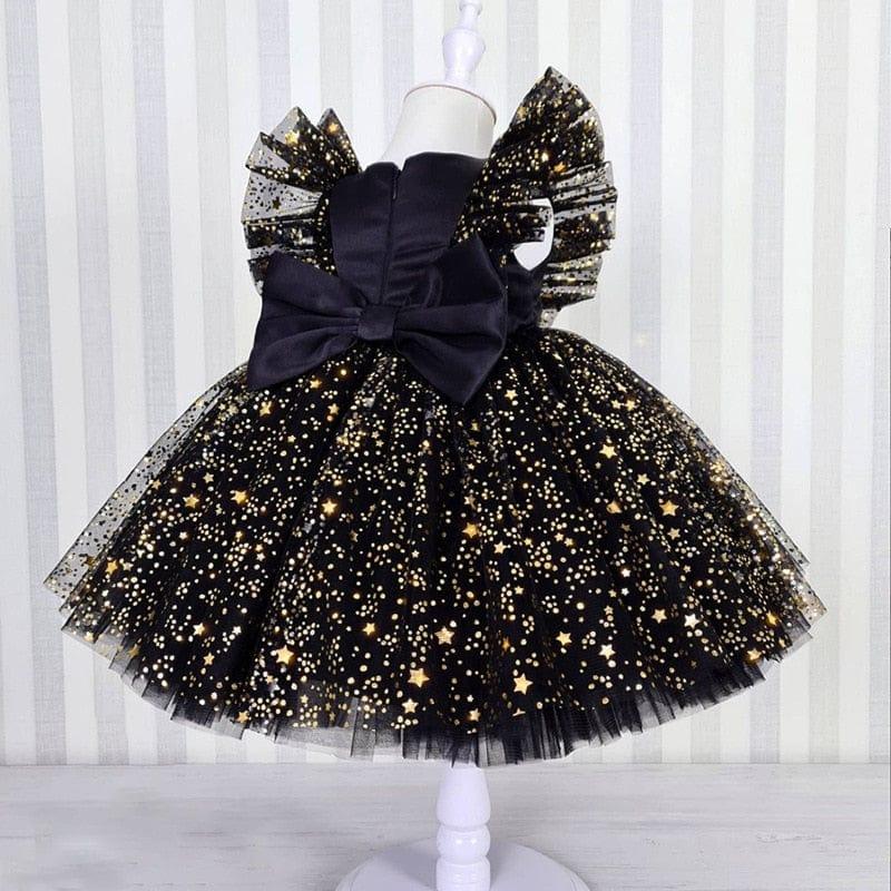 girls black and gold special occasion dress with lace star pattern and large bow for toddlers