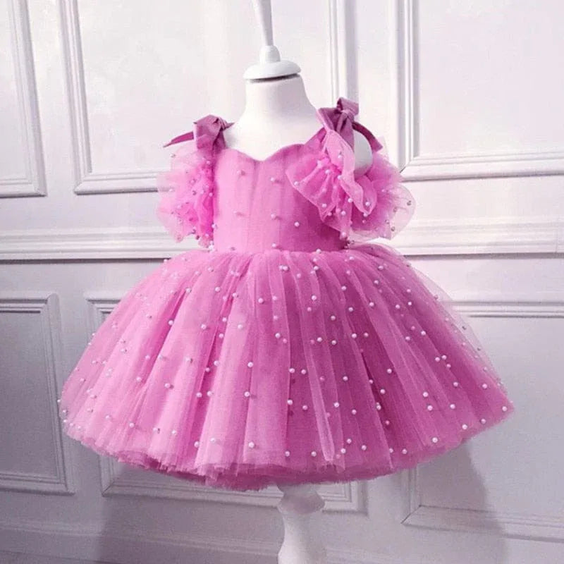  pink special occasion dress with lace and pearl embellishments, tulle skirt and puff sleeves