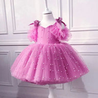  pink special occasion dress with lace and pearl embellishments, tulle skirt and puff sleeves