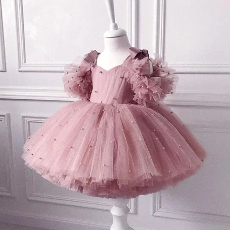 Pink special occasion dress with lace for girls, toddler size, puff sleeves and pearl accents
