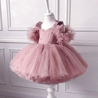 Pink special occasion dress with lace for girls, toddler size, puff sleeves and pearl accents