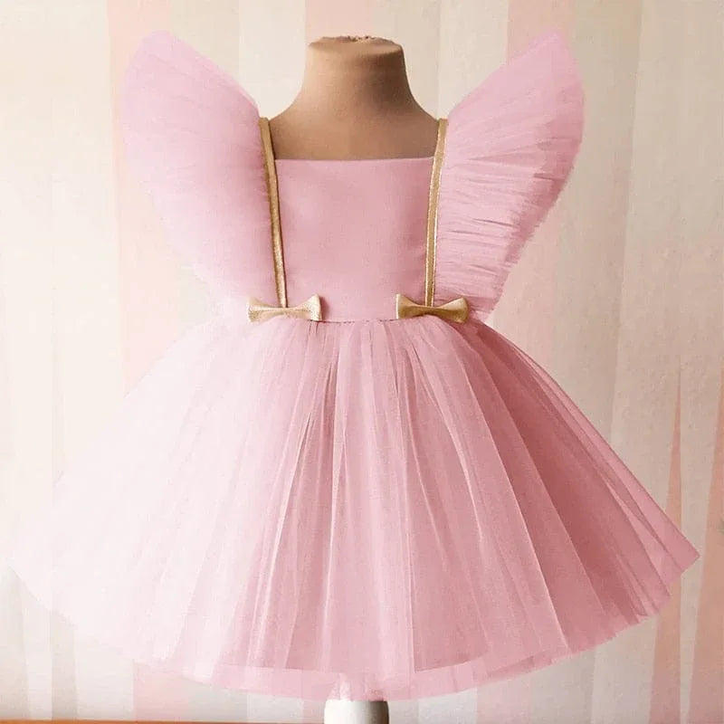 Girls pink special occasion dress with lace and tulle wings, toddler size with gold bow accents