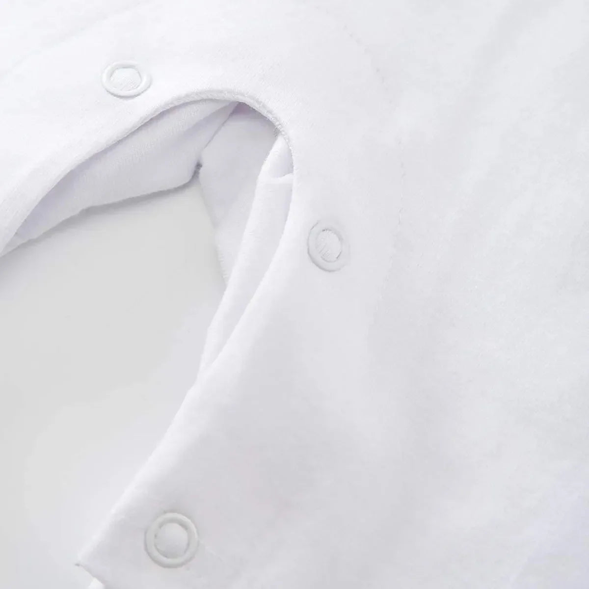 White sporty baby summer romper in size 0-6 months with snap button closure detail