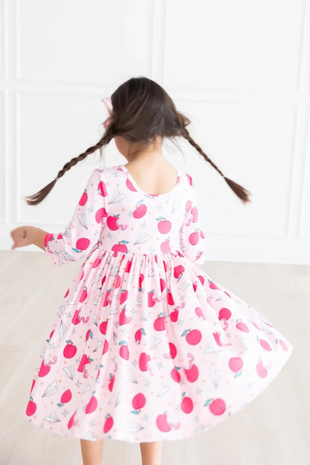 Girls white and pink star student twirl dress for girls with 3/4 sleeves and playful apple print