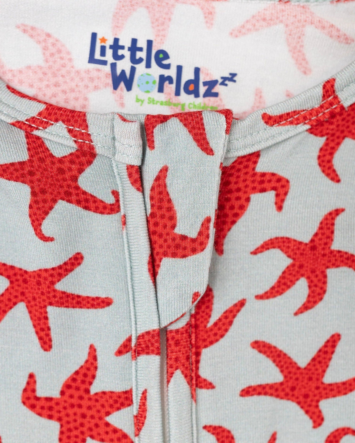 Red starfish print bamboo zipper footie pajamas with soft fabric and front zipper detail for babies.