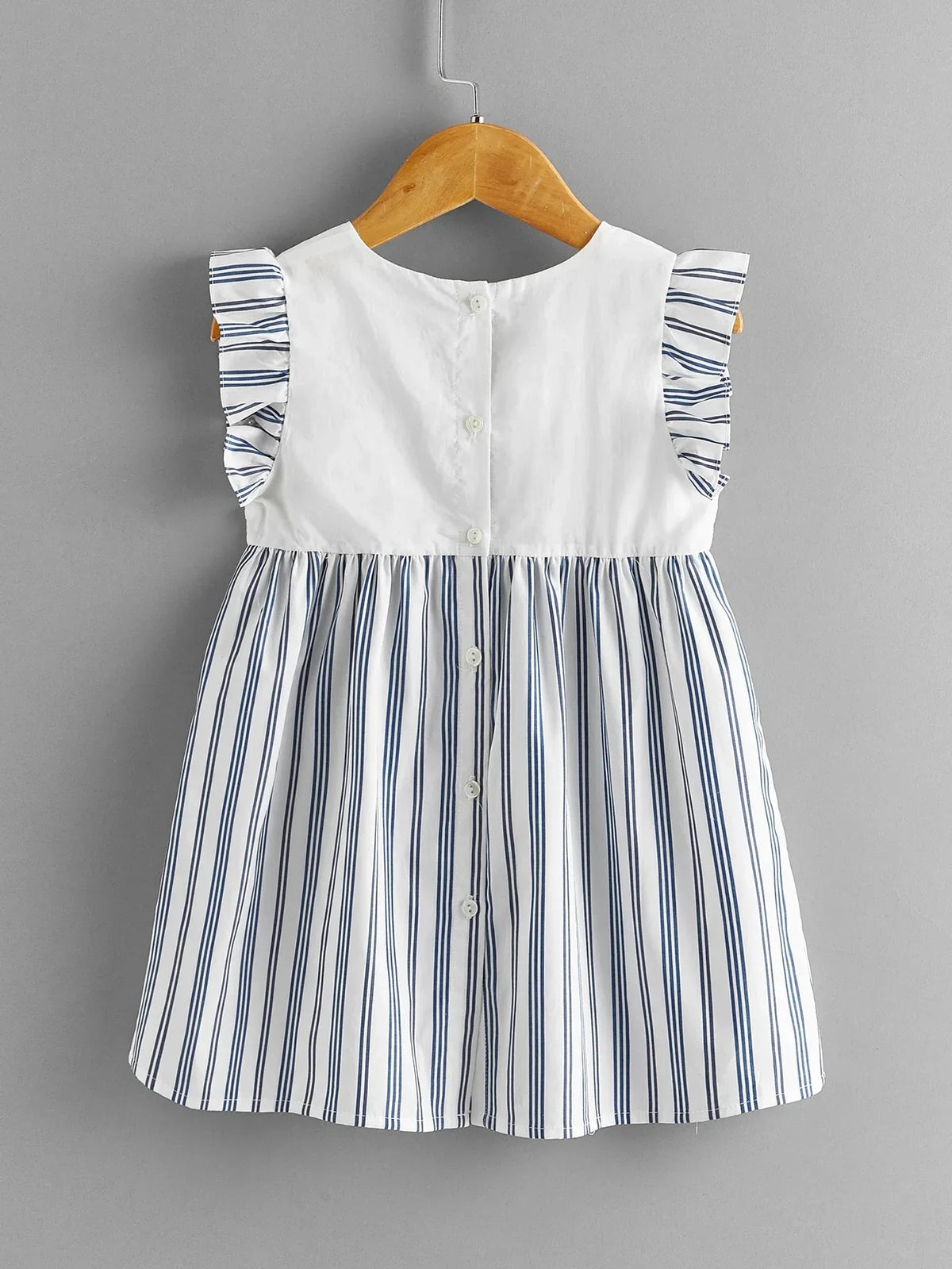 baby girls white and navy striped dress with ruffle sleeves and button back closure