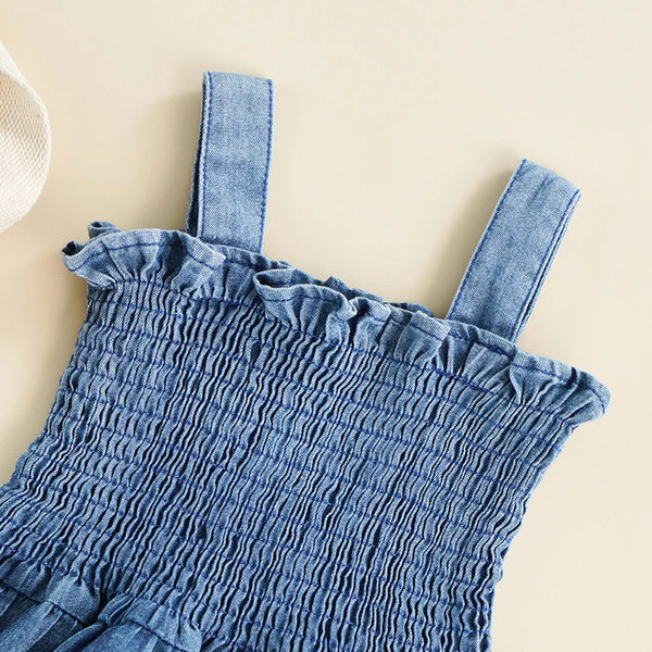 blue denim summer romper for babies with smocked bodice and ruffle trim shoulder straps
