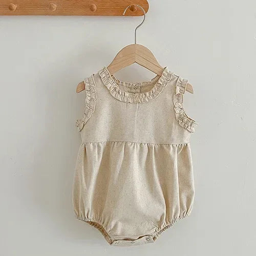 beige baby summer rompers with ruffle details on neckline and sleeves size 0 to 12 months