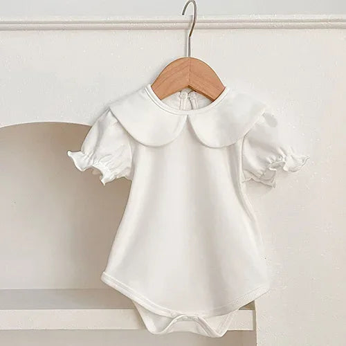 White baby summer rompers with puff sleeves and large rounded collar for infants