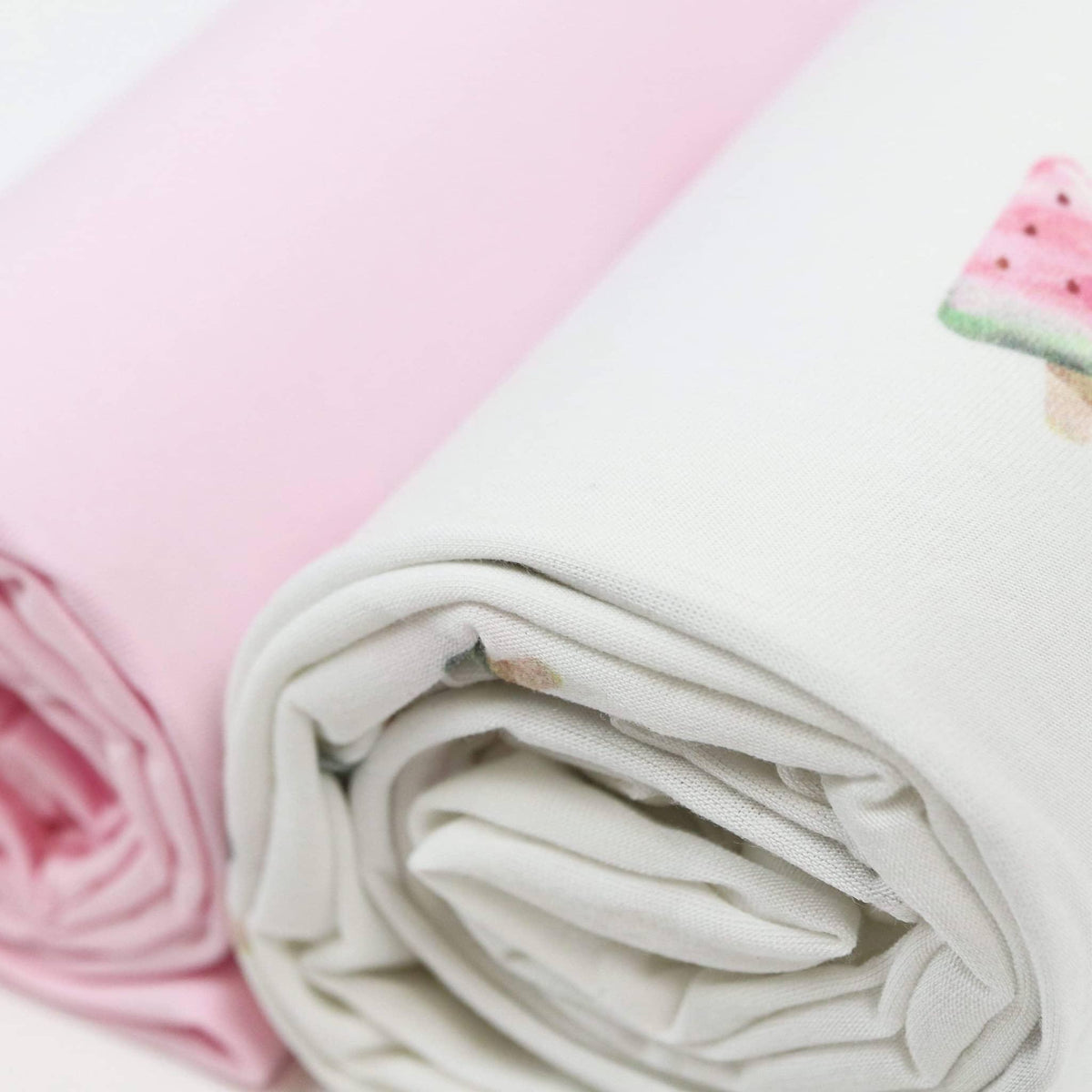 Goosewaddle swaddle blankets for newborns, white with watermelon print and solid pink, soft cotton