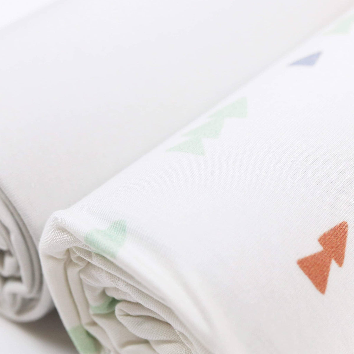 Goosewaddle white newborn swaddle blankets with pastel arrow pattern soft cotton fabric