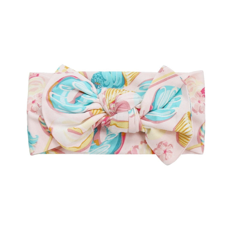 Colorful headband with a bow on a white background