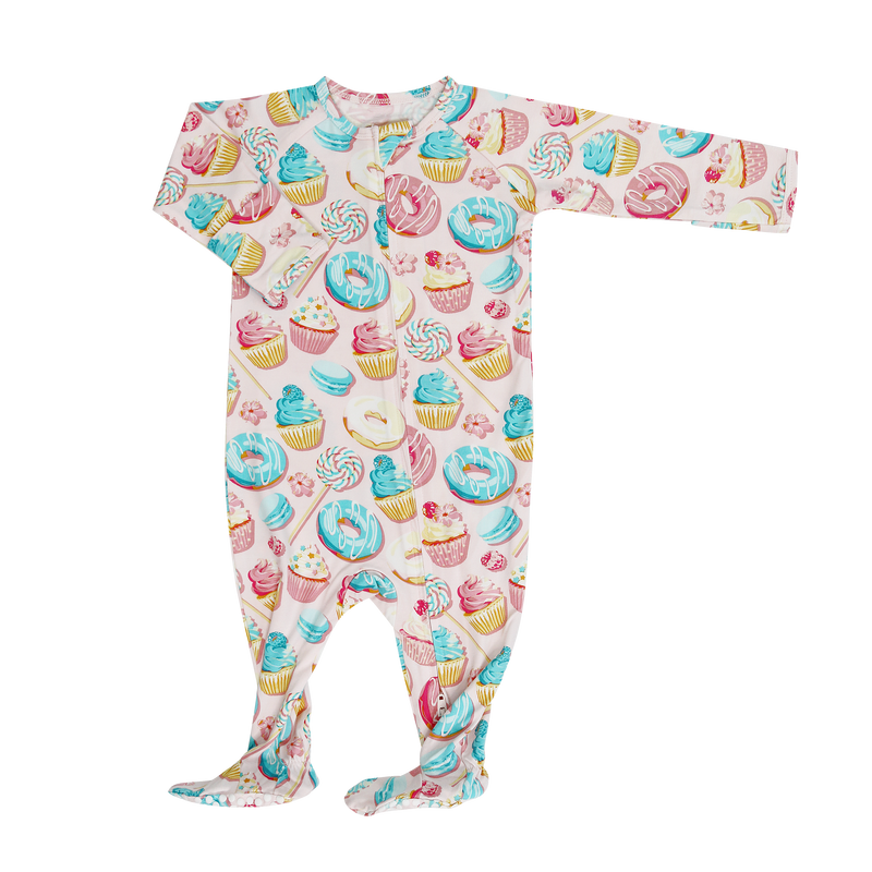Baby onesie with colorful donut, cupcake, and lollipop pattern on a white background
