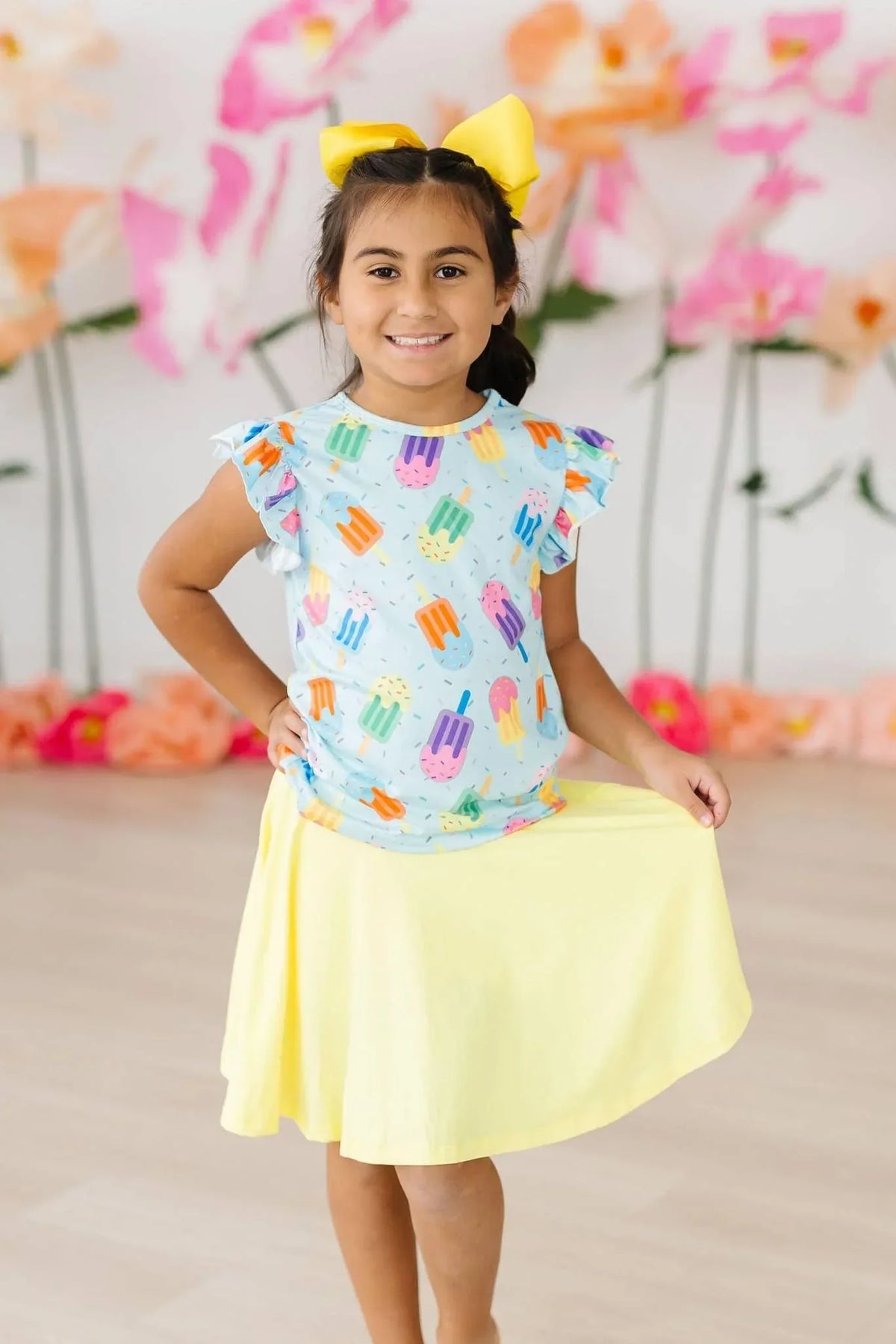 Girls white sweet treat ruffle sleeve tee with colorful popsicle print and yellow skirt