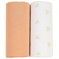Two newborn swaddle blankets rolled, featuring tan and terra cotta swaddle blankets from Goosewaddle