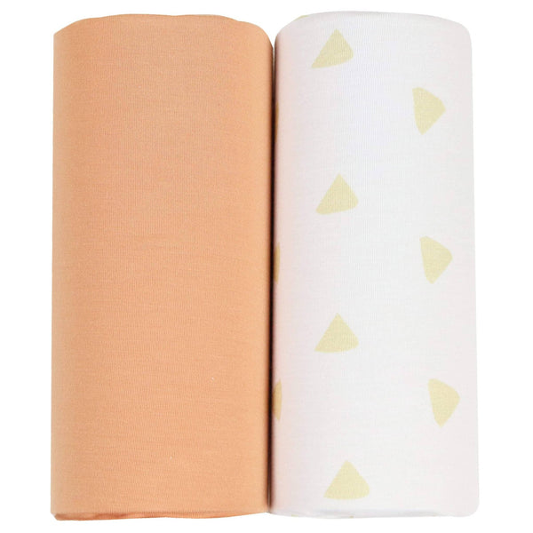 Two newborn swaddle blankets rolled, featuring tan and terra cotta swaddle blankets from Goosewaddle