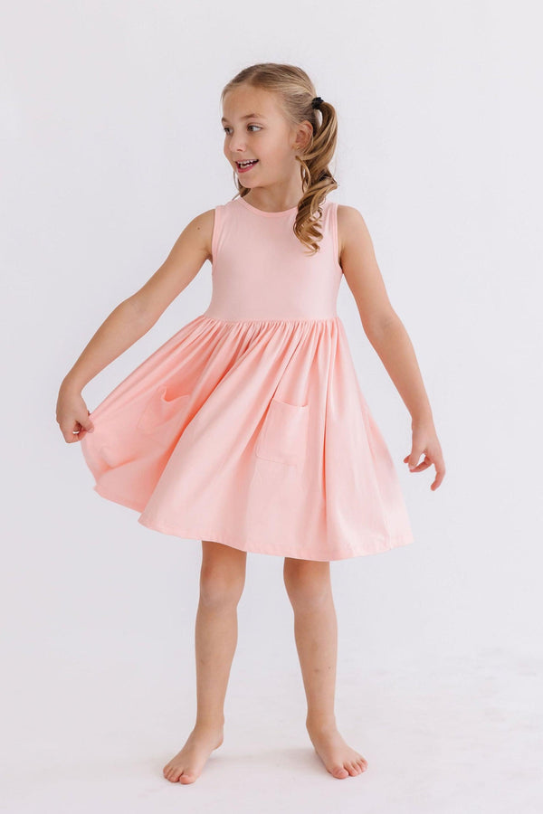 Girls light pink Mila & Rose Twirl Pocket tank dress with sleeveless design and playful skirt