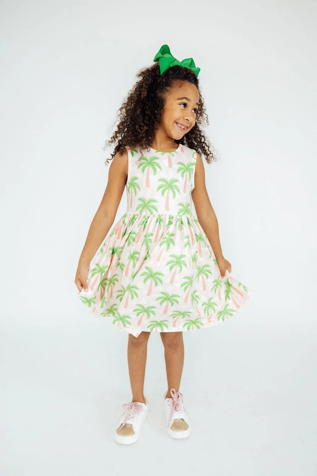 Girls pink tank twirl dress for girls with green palm tree print, sleeveless and knee-length