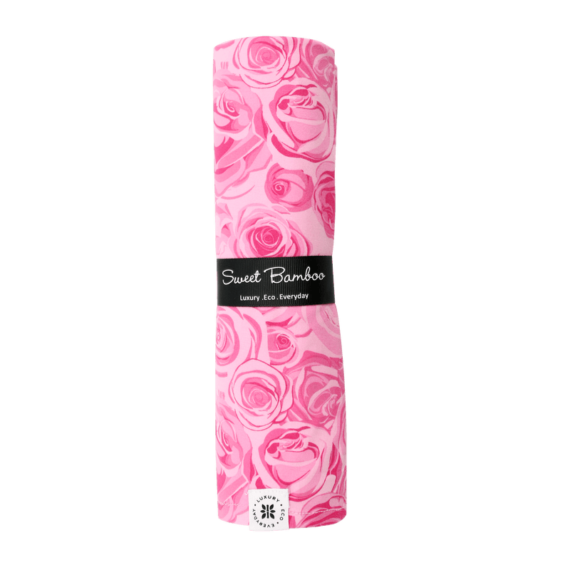 This Must Be Love swaddle in Palm Beach-inspired pink rose print on silky Ecolux jersey; soft, single-layer wrap.