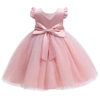 Pink girls tulle party dress with pearl accents and large bow, toddler size