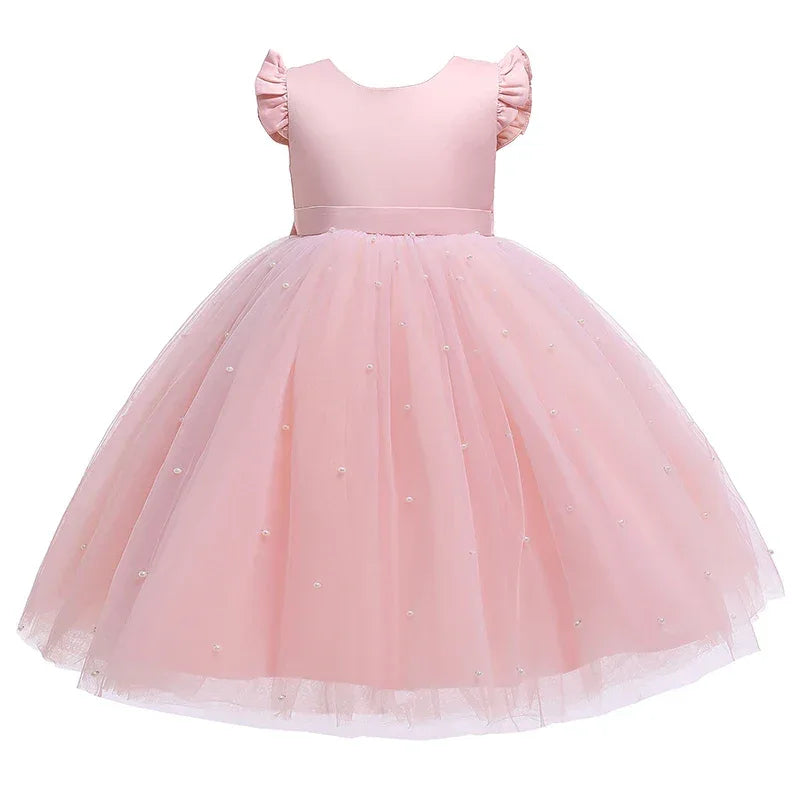 Pink girls tulle party dress with pearl embellishments and ruffled cap sleeves for toddlers