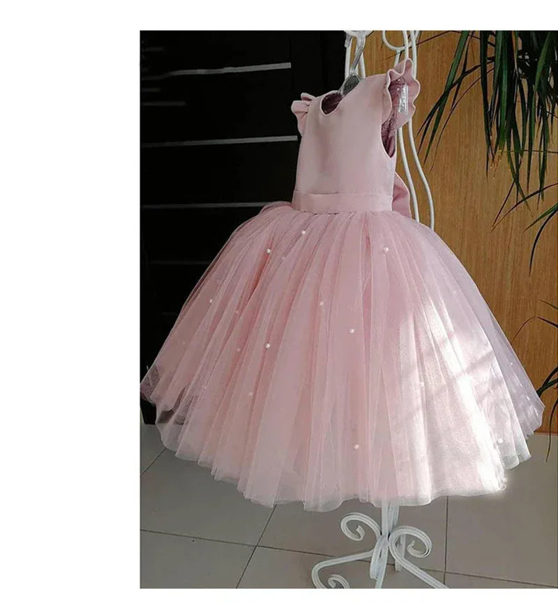 pink sleeveless tulle party dress for girls with pearl embellishments and full skirt