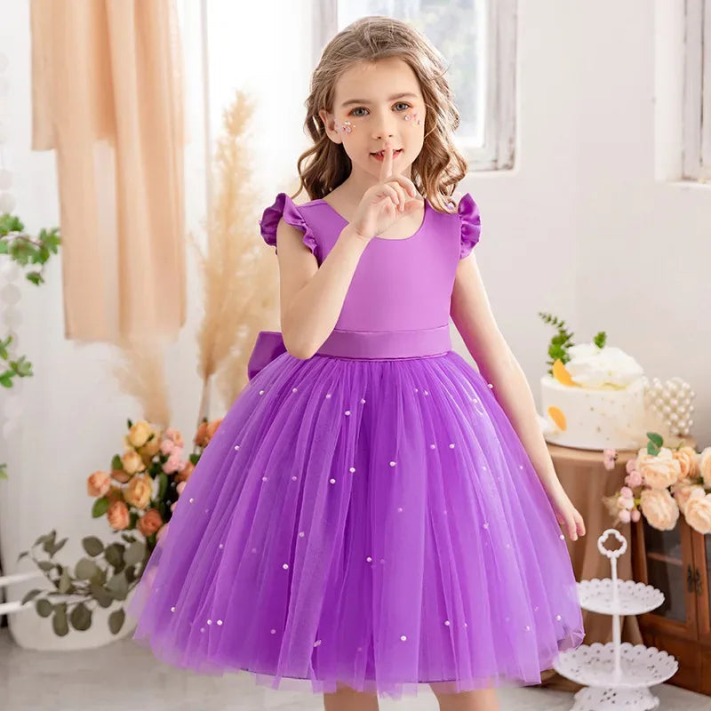 Girls purple tulle party dress with pearl accents and ruffled sleeves for kids
