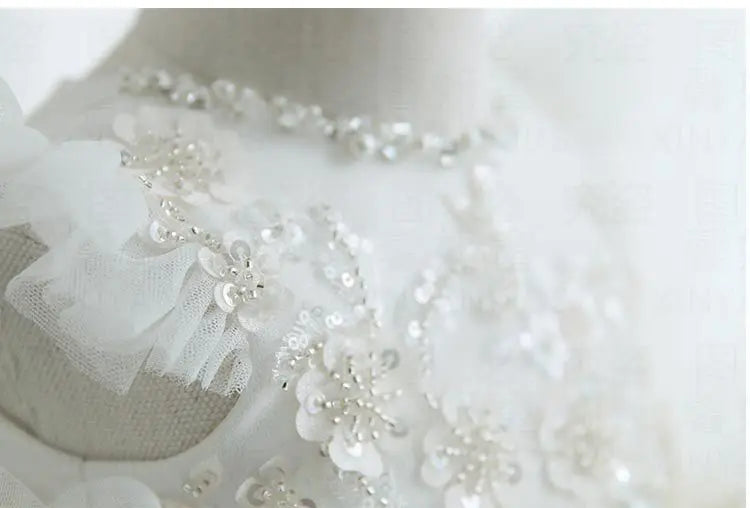 White tulle special occasion dress for girls with floral sequin and bead embellishments