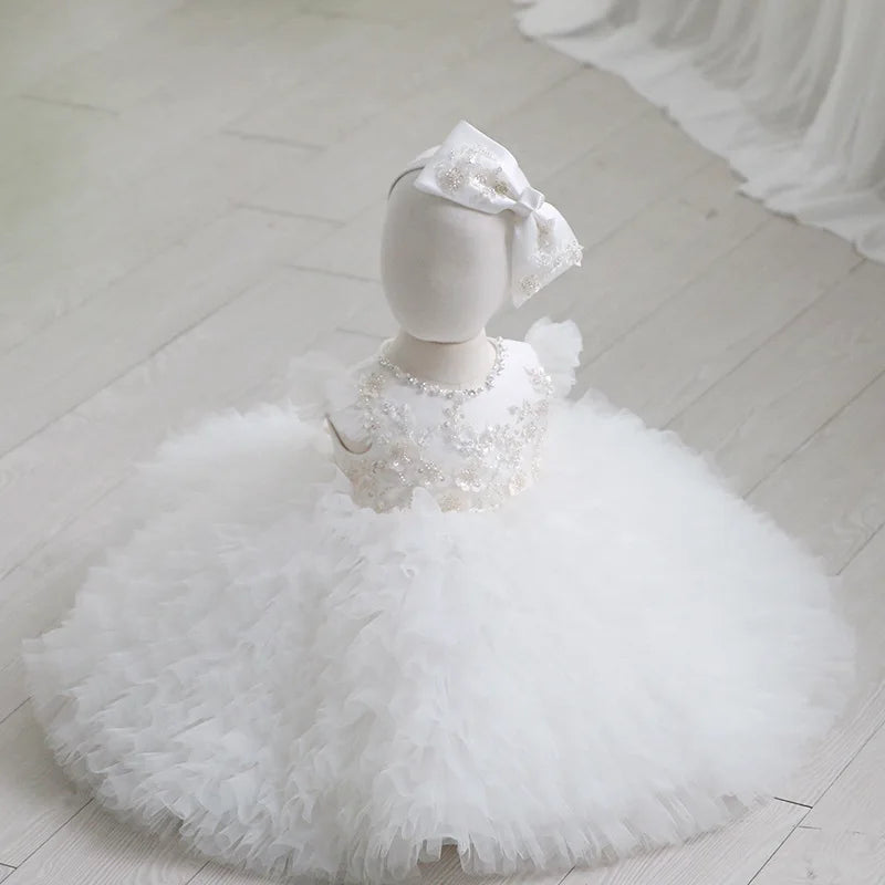 White tulle special occasion dress for girls with floral beadwork and large matching bow headband
