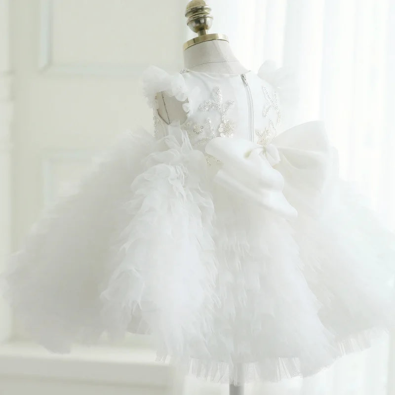 White tulle special occasion dress for girls with sparkling star details and large bow, toddler size