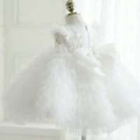 White tulle special occasion dress for girls with sparkling star details and large bow, toddler size
