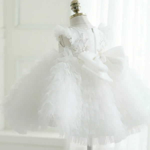 White tulle special occasion dress for girls with sparkling star details and large bow, toddler size
