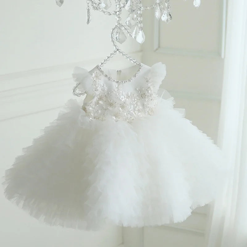 White tulle special occasion dress for girls with floral embroidery and ruffled sleeves