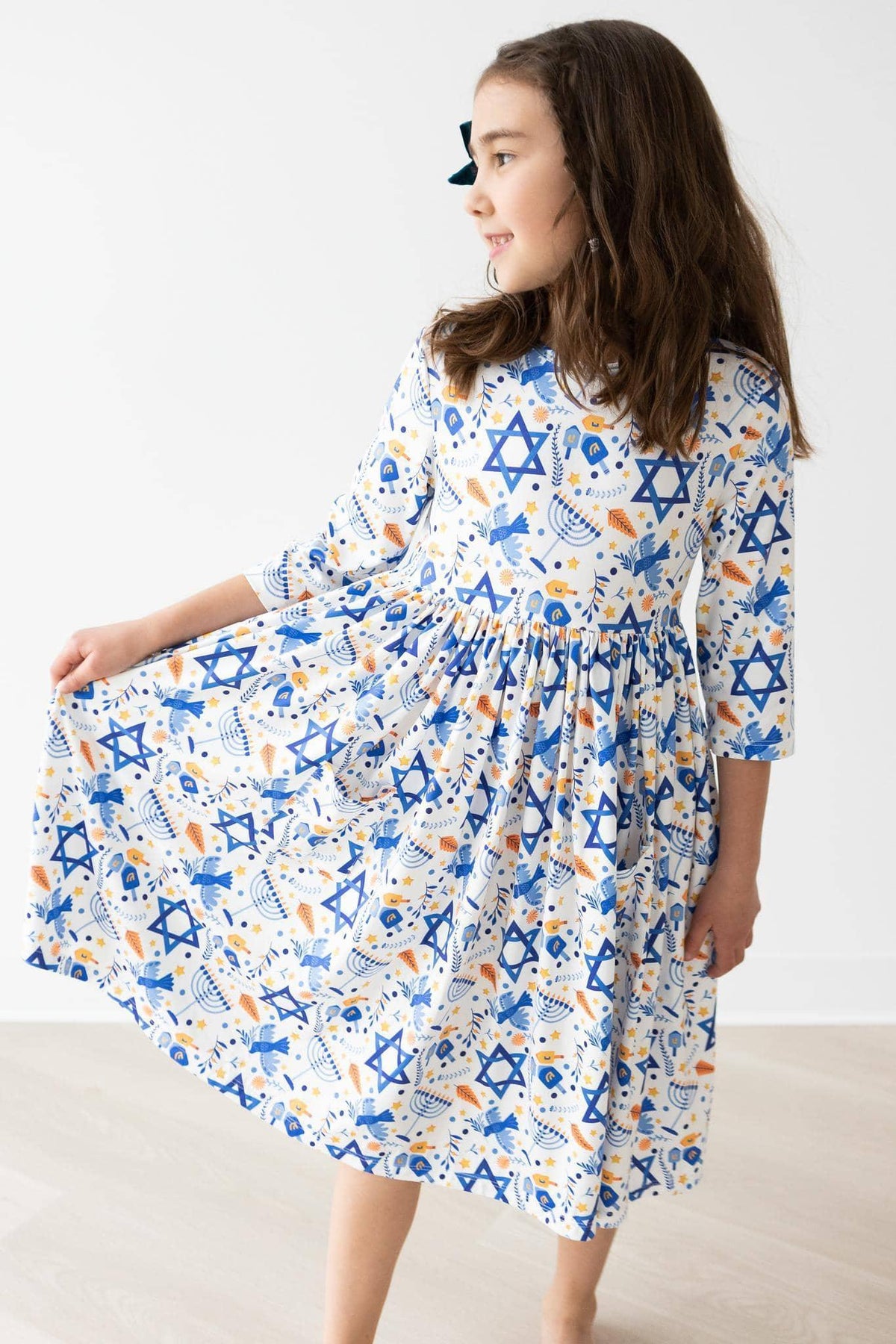 Girls white and blue sleeve twirl dress with Star of David pattern by Mila & Rose