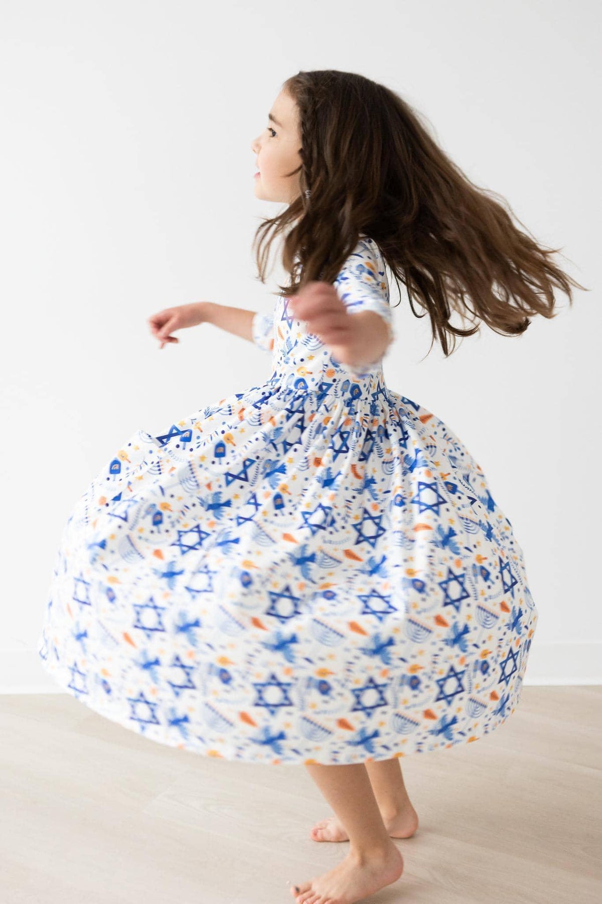Girls white and blue Twirl dress sleeves and star pattern by Mila and Rose
