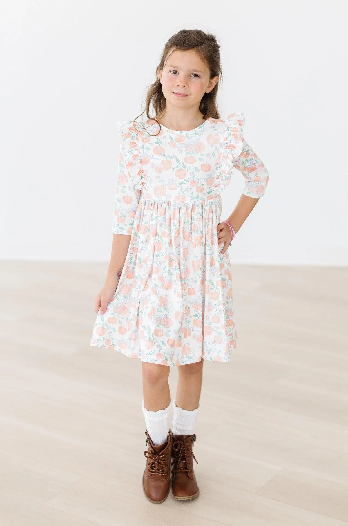 Girls 3 4 sleeve twirl dress for girls by Mila Rose in white with peach floral ruffles