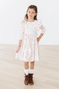 Girls 3 4 sleeve twirl dress for girls by Mila Rose in white with peach floral ruffles