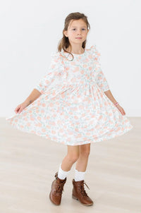 Girls white and peach floral twirl dress for girls with 3/4 sleeves and ruffle details