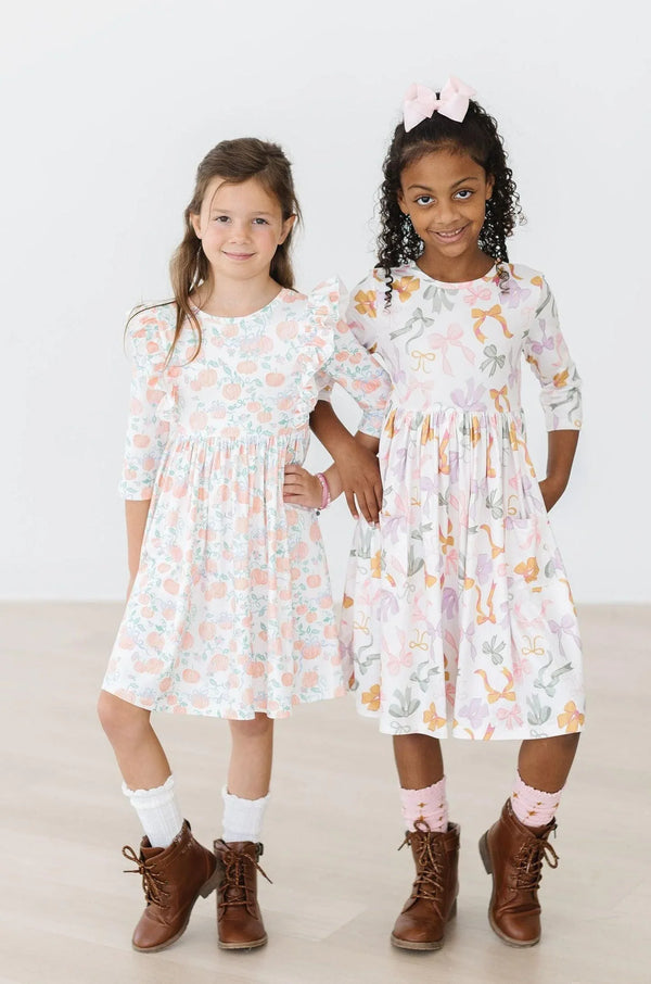 Girls twirl dress for girls white and pastel floral 3 quarter sleeve with ruffle detail size 7 and 8