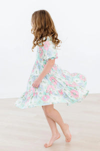 Girls pastel floral smocked ruffle twirl dress for girls, knee-length with puff sleeves
