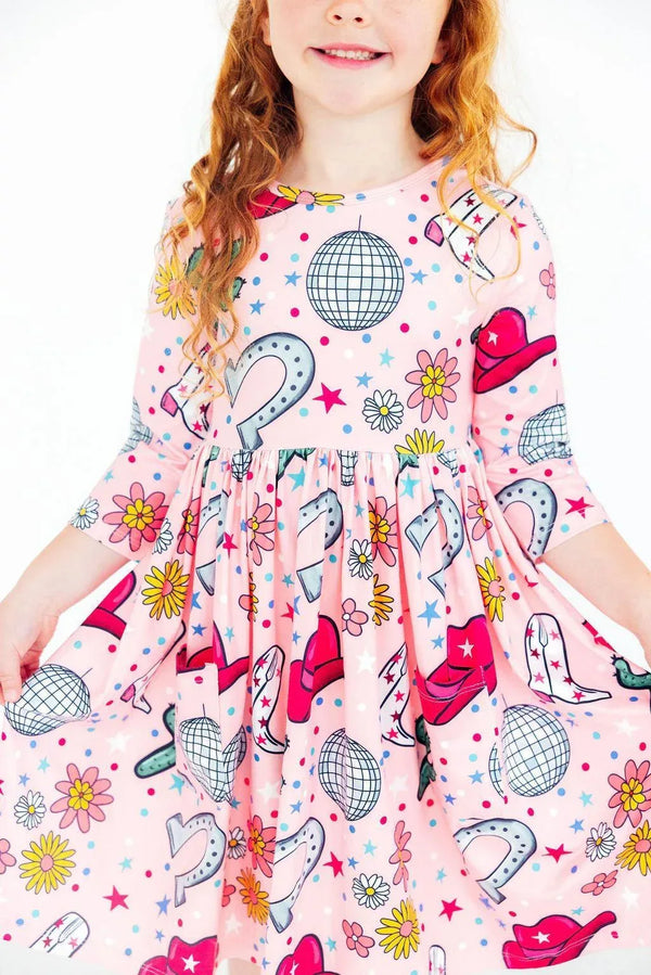 Girls pink twirl dress with long sleeves and colorful cowboy hat and disco ball print for ages 4 to 6