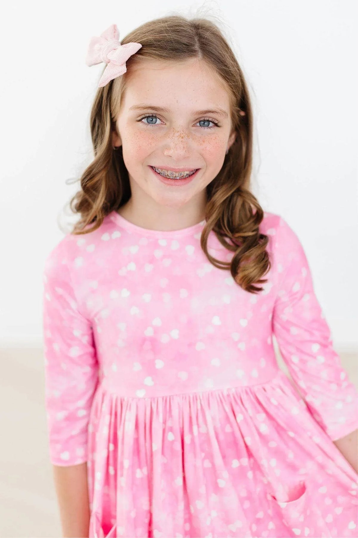 Girls pink twirl dress with white heart pattern 3 4 sleeves by Mila & Rose