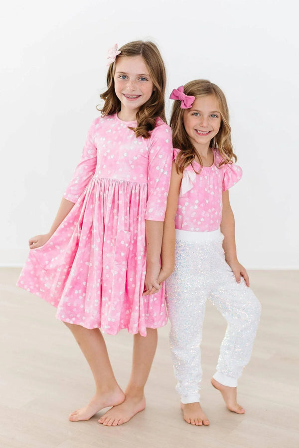 Girls pink Mila Rose twirl dress with 3/4 sleeves and white polka dots, knee length