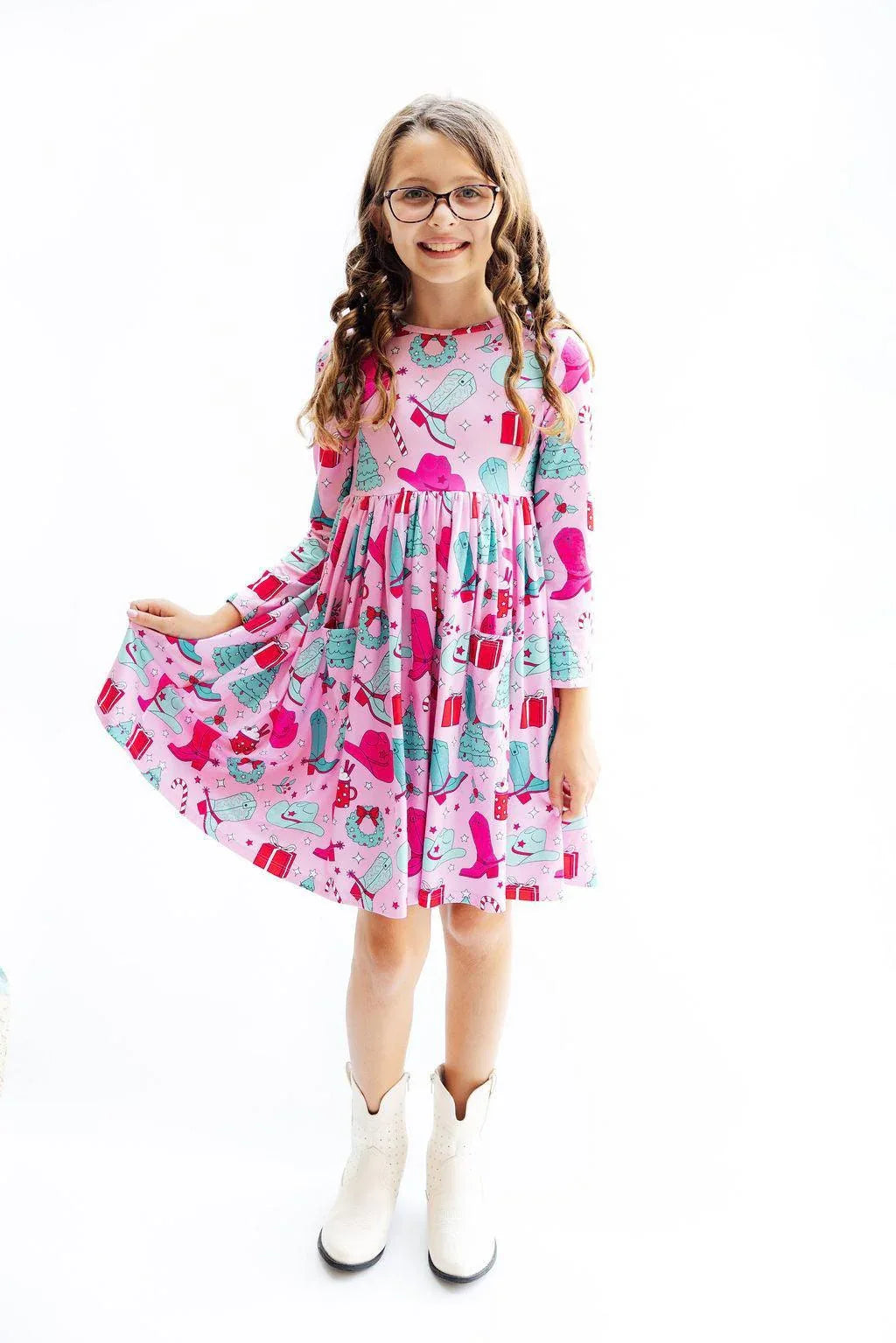 Girls pink twirl dress with long sleeves and pocket featuring fun colorful prints