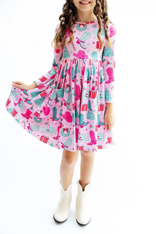 Girls pink twirl dress with long sleeves and pocket featuring colorful fashion accessories print