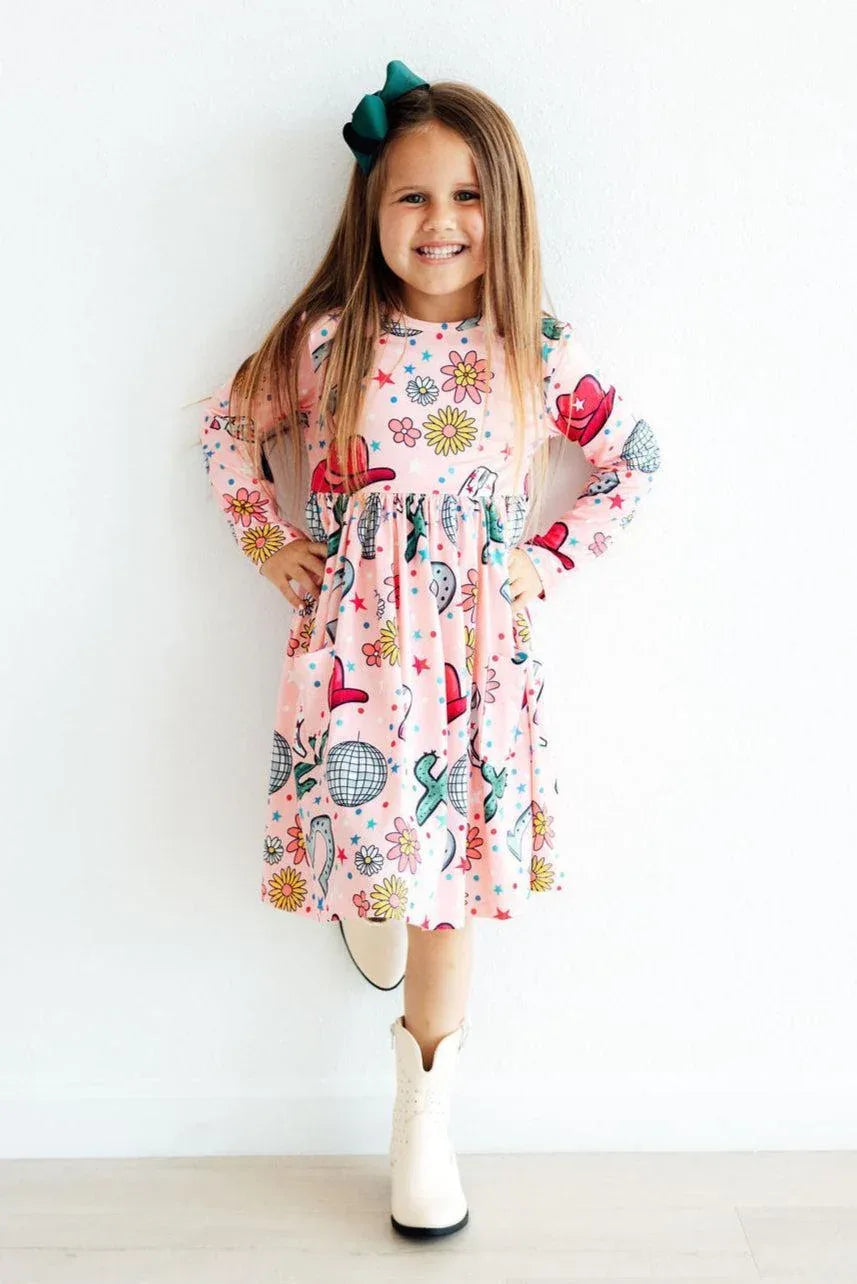 Girls pink twirl dress with long sleeves and pockets featuring colorful flower and butterfly print